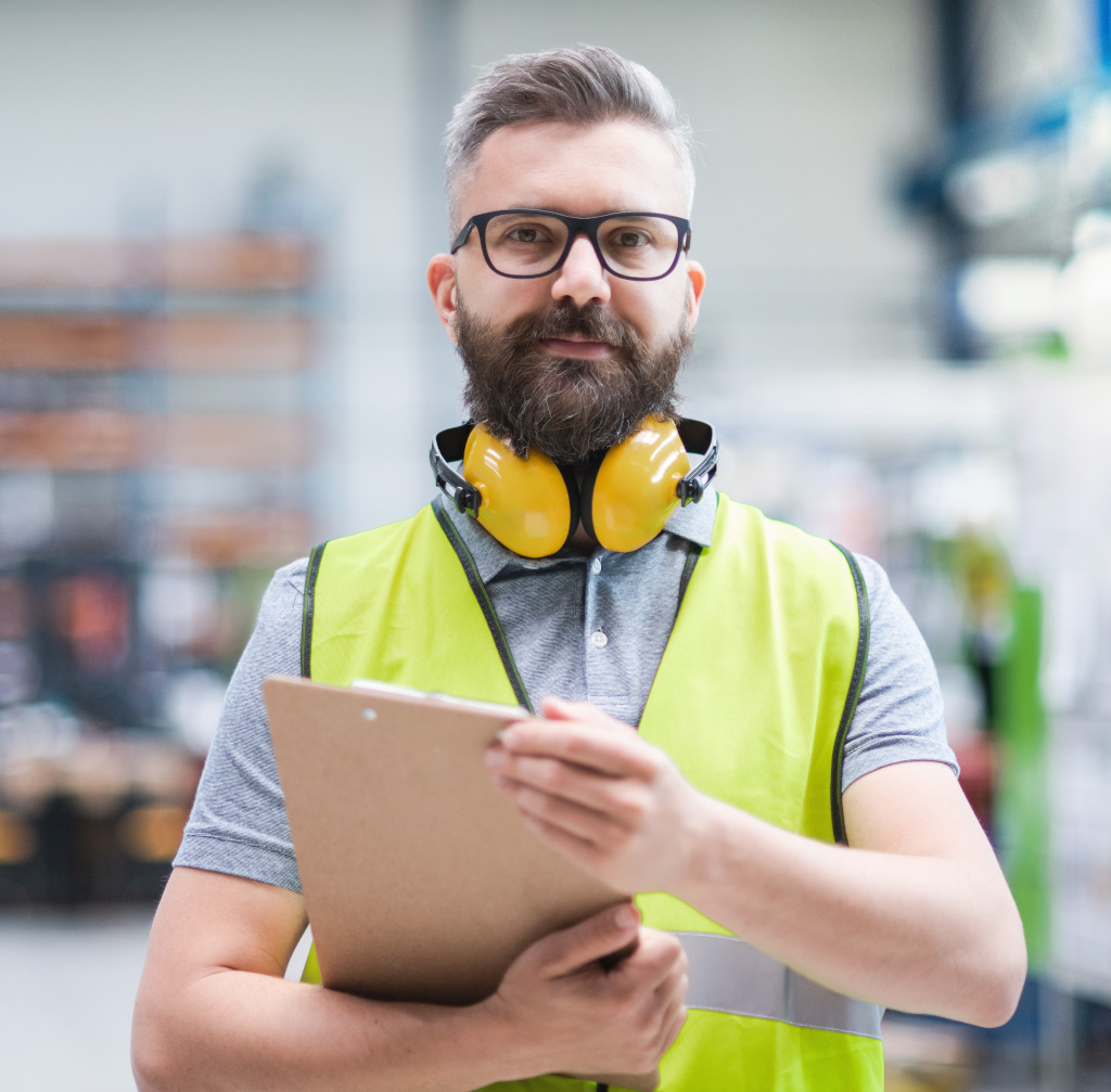 technician-or-engineer-with-protective-headphones-59BQWU2.jpg